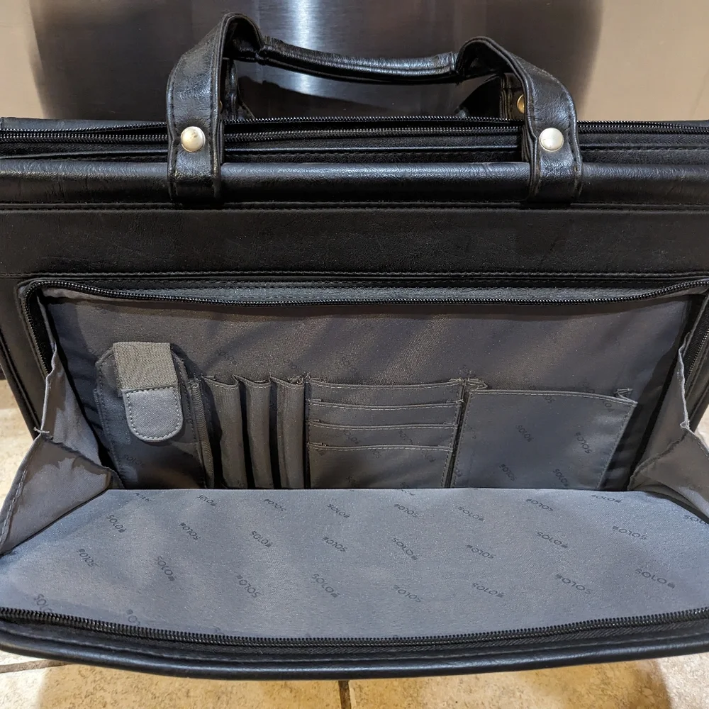 Solo brand black leather briefcase new never used. Missing shoulder strap.